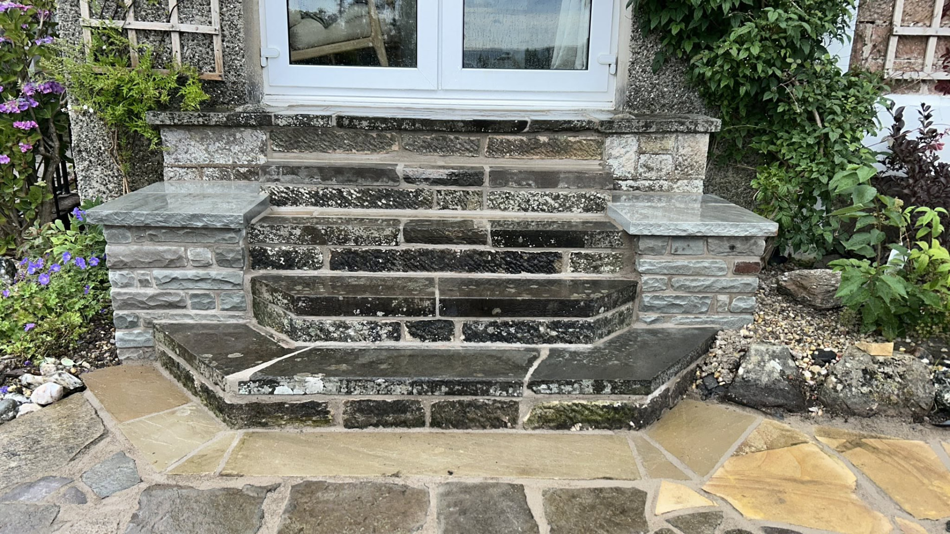 Traditional stone entrance steps with side walls